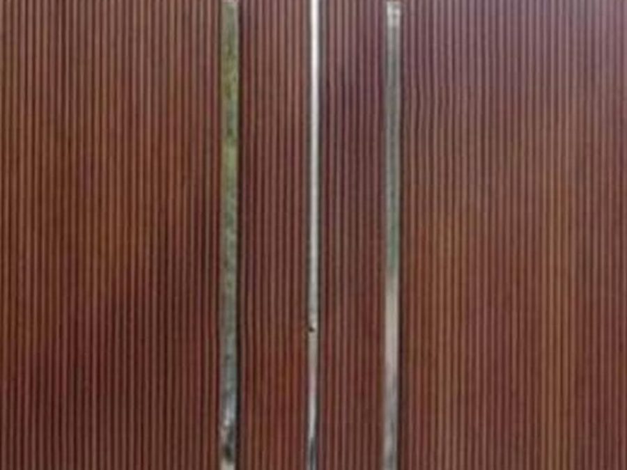 Aluminium gate cladding in a wood finish