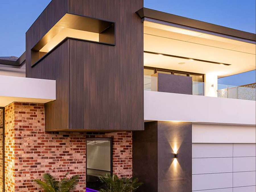 NewTechWood composite cladding on a house at dusk
