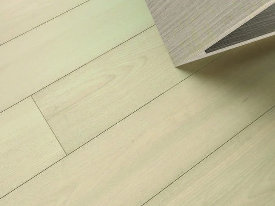 Elegance Walnut flooring with a sofa and lamp