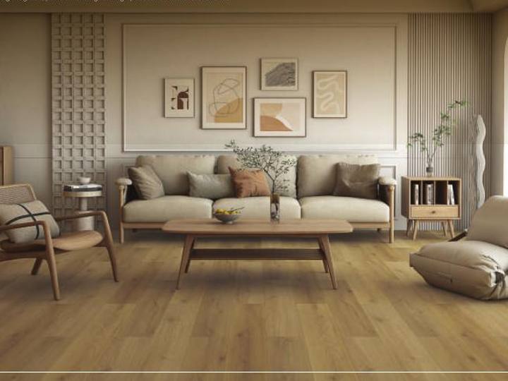 Apartment living room floored in Majesty Grande wide-plank hybrid flooring
