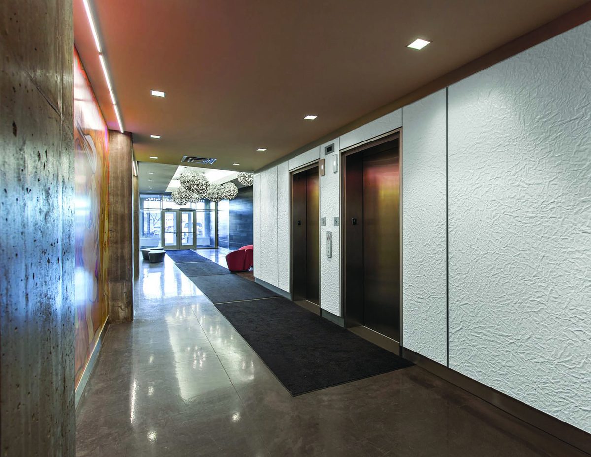Lift lobby with doors faced in bonded metal
